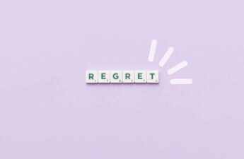 text says regret in scrabble letters with pink background