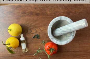 two lemons, 1 tomato, 3 pills, a mortar and pestle, and a bottle of oil for article: "Can Vitamins Help with Locs Growth"