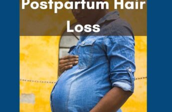 woman wearing blue shirt holding hird pregnant belly